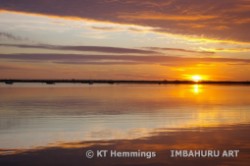 [Sunrise on the Exe estuary in January looking across Dawlish Warren spit]